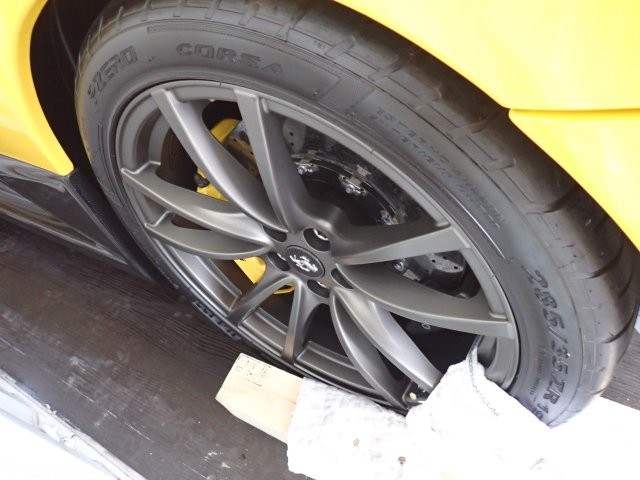 Ferrari F12 TDF wheel and securing elements inside the container