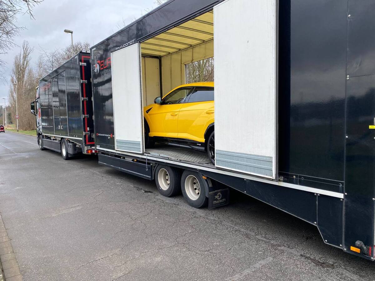 Lamborghini Urus S inside an enclosed car transporter