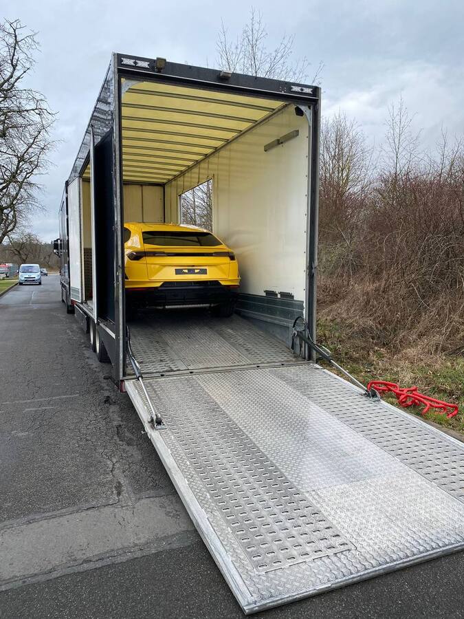 Lamborghini Urus S inside the enclosed transporter before unloading