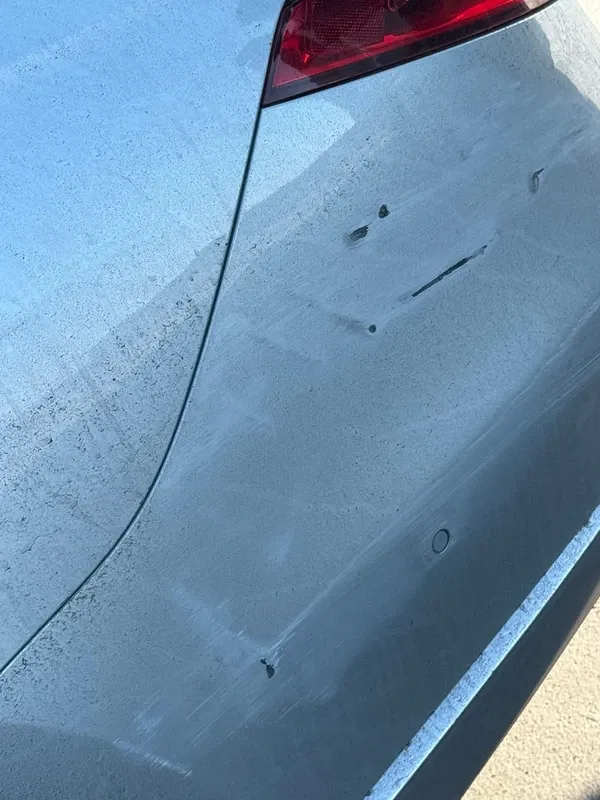 Closer view of the same Mercedes rear bumper damage